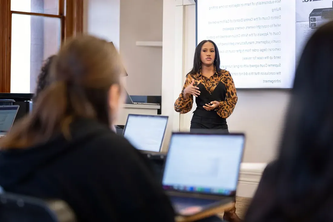 A person talking to a class.